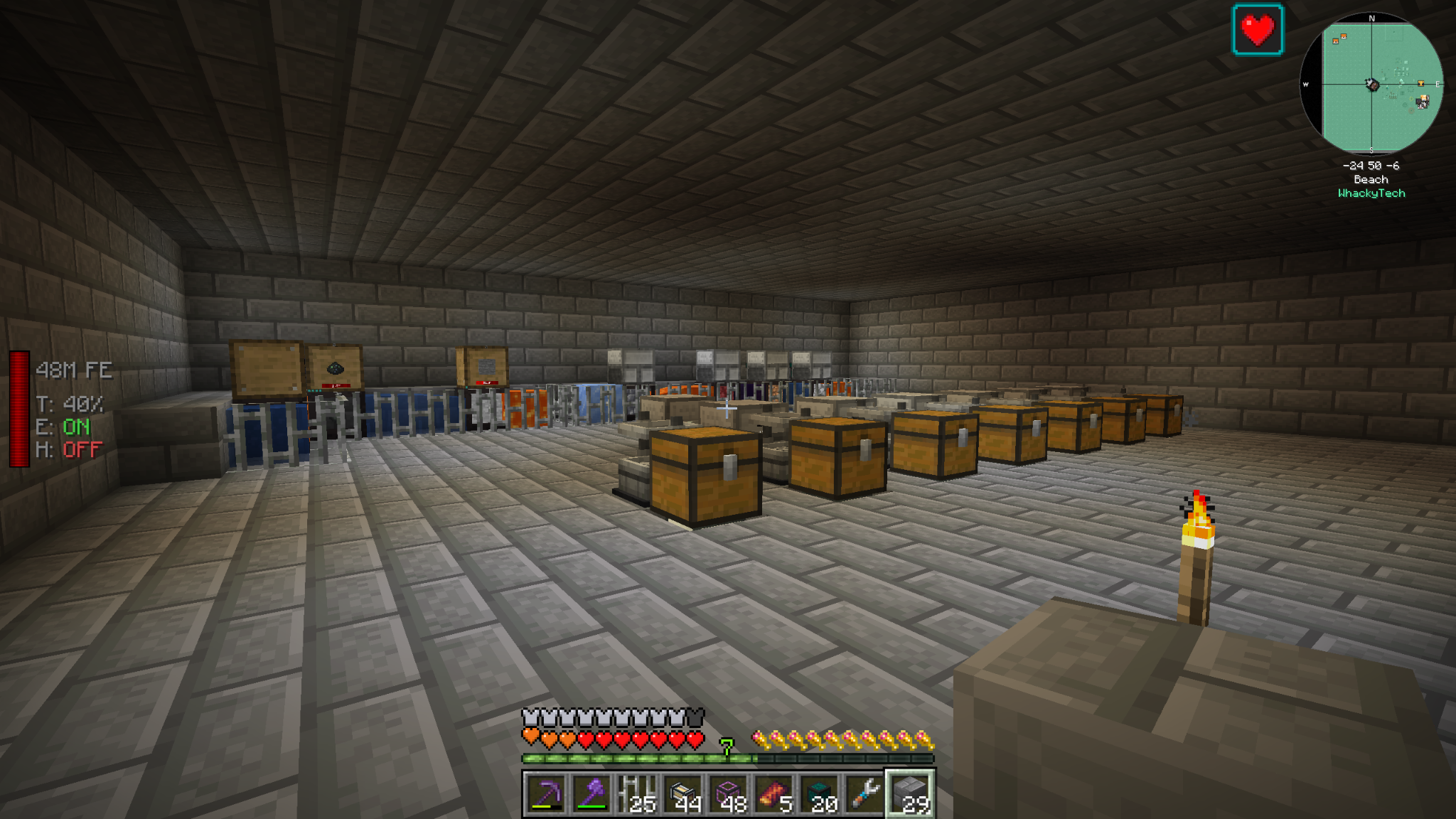 A stone-walled Minecraft room with machinery, ducts, and rows of chests.